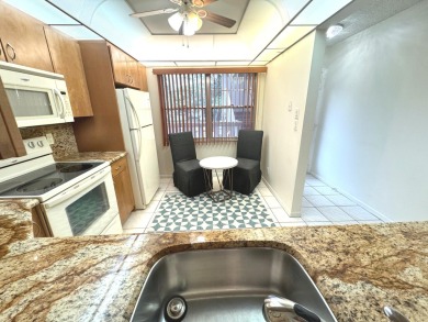 **DRASTIC REDUCTION** GATED, GOLF COMMUNITY WITH THEATER on Wynmoor Golf Course in Florida - for sale on GolfHomes.com, golf home, golf lot