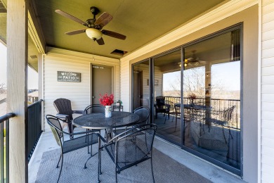 Indulge in cozy cabin vibes with this inviting 2-bedroom on Pointe Royale Village Country Club in Missouri - for sale on GolfHomes.com, golf home, golf lot
