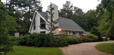 A must-see home in Lake Royale. This beautiful A Frame home on River Golf and Country Club at Lake Royale in North Carolina - for sale on GolfHomes.com, golf home, golf lot