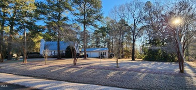 A must-see home in Lake Royale. This beautiful A Frame home on River Golf and Country Club at Lake Royale in North Carolina - for sale on GolfHomes.com, golf home, golf lot