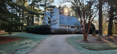 A must-see home in Lake Royale. This beautiful A Frame home on River Golf and Country Club at Lake Royale in North Carolina - for sale on GolfHomes.com, golf home, golf lot