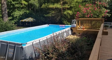 A must-see home in Lake Royale. This beautiful A Frame home on River Golf and Country Club at Lake Royale in North Carolina - for sale on GolfHomes.com, golf home, golf lot