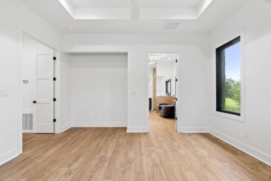 Stylish Hill Country contemporary home backing up to the #1 tee on Apple Rock Golf Course - Horseshoe Bay in Texas - for sale on GolfHomes.com, golf home, golf lot