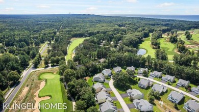 Welcome to 12604 Retreat Dr, Grand Haven! This beautifully on Grand Haven Golf Club in Michigan - for sale on GolfHomes.com, golf home, golf lot