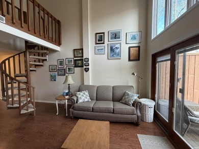 This inviting Lake Monroe condo features soaring ceilings and on The Eagle Pointe Golf Resort in Indiana - for sale on GolfHomes.com, golf home, golf lot