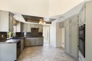 The home is located in the Guard Gated Lake community of Laguna on La Quinta Golf  Resort and Country Clubs in California - for sale on GolfHomes.com, golf home, golf lot