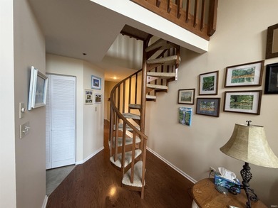 This inviting Lake Monroe condo features soaring ceilings and on The Eagle Pointe Golf Resort in Indiana - for sale on GolfHomes.com, golf home, golf lot