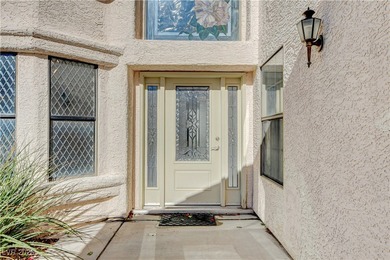 This 2-story home is located in Painted Desert, a guard-gated on Painted Desert Golf Club in Nevada - for sale on GolfHomes.com, golf home, golf lot