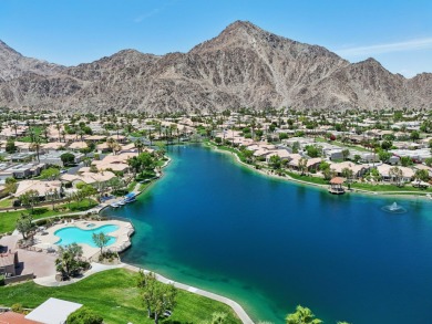 The home is located in the Guard Gated Lake community of Laguna on La Quinta Golf  Resort and Country Clubs in California - for sale on GolfHomes.com, golf home, golf lot