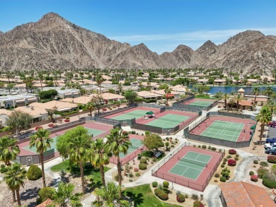 The home is located in the Guard Gated Lake community of Laguna on La Quinta Golf  Resort and Country Clubs in California - for sale on GolfHomes.com, golf home, golf lot