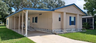 Come settle down and relax in a beautiful, manufactured home on Fairways Country Club in Florida - for sale on GolfHomes.com, golf home, golf lot