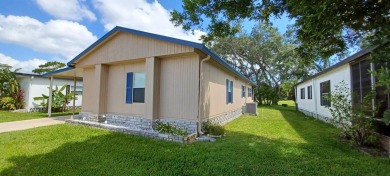 Come settle down and relax in a beautiful, manufactured home on Fairways Country Club in Florida - for sale on GolfHomes.com, golf home, golf lot