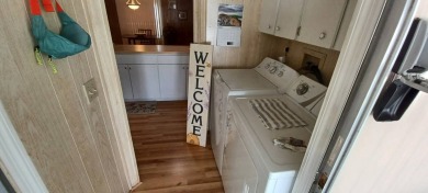 Come settle down and relax in a beautiful, manufactured home on Fairways Country Club in Florida - for sale on GolfHomes.com, golf home, golf lot
