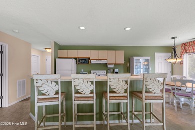 Discover easy coastal living in this desirable 2-bedroom, 2-bath on Oyster Bay Golf Links in North Carolina - for sale on GolfHomes.com, golf home, golf lot