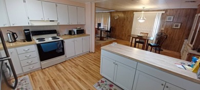 Come settle down and relax in a beautiful, manufactured home on Fairways Country Club in Florida - for sale on GolfHomes.com, golf home, golf lot