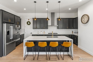 Highly appointed ranch situated on a spacious corner lot with on Raindance National Golf Course in Colorado - for sale on GolfHomes.com, golf home, golf lot