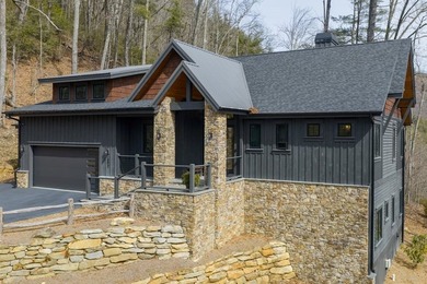 Completed in 2021, this beautifully crafted mountain home offers on Cullasaja Club in North Carolina - for sale on GolfHomes.com, golf home, golf lot