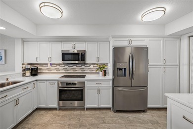 Experience vibrant coastal living at its finest in this on Isla Del Sol Yacht and Country Club in Florida - for sale on GolfHomes.com, golf home, golf lot