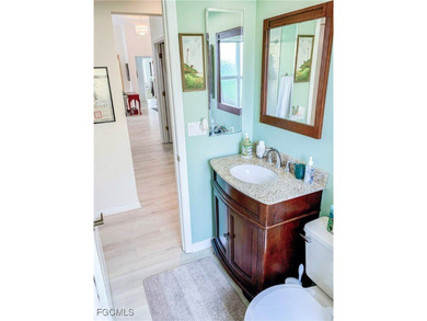 Welcome home to your private lakeside retreat in the highly on Cross Creek Country Club in Florida - for sale on GolfHomes.com, golf home, golf lot