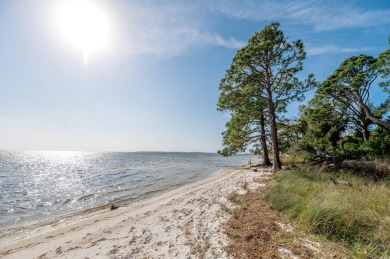 Discover luxury living in this exquisite 3-bedroom, 2.5-bathroom on Bay Point Resort Golf Club in Florida - for sale on GolfHomes.com, golf home, golf lot