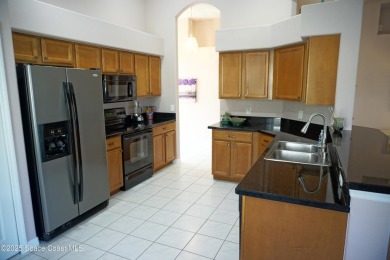 This 3 bedroom 2 bathroom home with high ceilings and relaxing on Majors Golf Club At Bayside Lakes in Florida - for sale on GolfHomes.com, golf home, golf lot