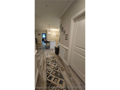 This luxury condo in Fairway Pointe in Anderson Creek Club is on Anderson Creek Golf Club in North Carolina - for sale on GolfHomes.com, golf home, golf lot