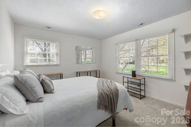 Set along a golf-course setting with a generous lot and room to on  in North Carolina - for sale on GolfHomes.com, golf home, golf lot