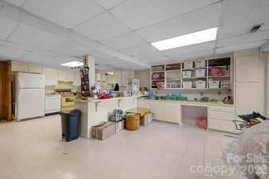 Set along a golf-course setting with a generous lot and room to on  in North Carolina - for sale on GolfHomes.com, golf home, golf lot