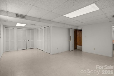 Set along a golf-course setting with a generous lot and room to on  in North Carolina - for sale on GolfHomes.com, golf home, golf lot