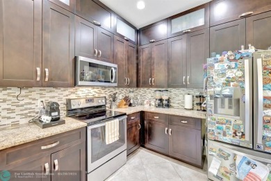 STUNNING 4-BEDROOM 3-BATHROOM POOL HOME IN THE HEART OF CORAL on Country Club of Coral Springs in Florida - for sale on GolfHomes.com, golf home, golf lot