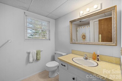 Set along a golf-course setting with a generous lot and room to on  in North Carolina - for sale on GolfHomes.com, golf home, golf lot