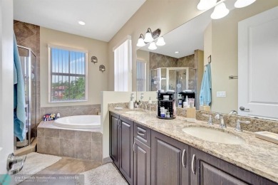 STUNNING 4-BEDROOM 3-BATHROOM POOL HOME IN THE HEART OF CORAL on Country Club of Coral Springs in Florida - for sale on GolfHomes.com, golf home, golf lot