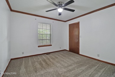 Enjoy lake views of St. George from this beautifully updated 1 on Druid Hills Golf Club in Tennessee - for sale on GolfHomes.com, golf home, golf lot