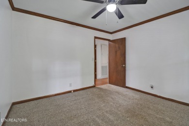 Enjoy lake views of St. George from this beautifully updated 1 on Druid Hills Golf Club in Tennessee - for sale on GolfHomes.com, golf home, golf lot