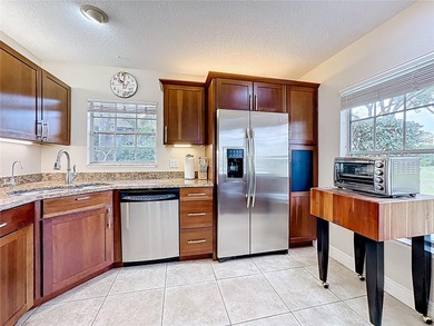 HEATHROW  - RACQUET CLUB VILLAS - Live in the beautiful gated on Heathrow Country Club in Florida - for sale on GolfHomes.com, golf home, golf lot