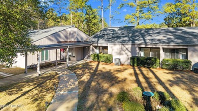 Welcome to this quaint waterfront and golf view Condo. Enjoy on Whispering Pines Golf Course in North Carolina - for sale on GolfHomes.com, golf home, golf lot