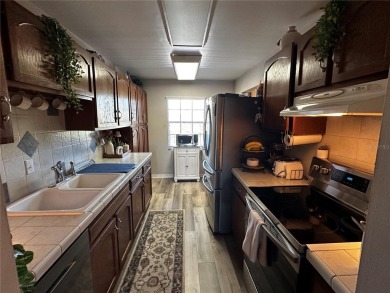 Home Sweet Home can be yours in this meticulously maintained on Bayou Golf Club in Florida - for sale on GolfHomes.com, golf home, golf lot