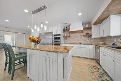 This 4BR/3BA CBS pool home sits on a private 1-acre cul-de-sac on Evergreen Club in Florida - for sale on GolfHomes.com, golf home, golf lot