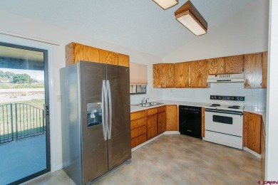 Beautiful Townhome with Mountain Views Bordering Black Canyon on Black Canyon Golf Club At Montrose in Colorado - for sale on GolfHomes.com, golf home, golf lot