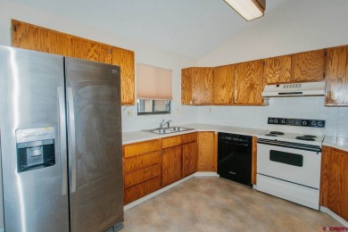 Beautiful Townhome with Mountain Views Bordering Black Canyon on Black Canyon Golf Club At Montrose in Colorado - for sale on GolfHomes.com, golf home, golf lot