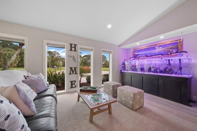 This 4BR/3BA CBS pool home sits on a private 1-acre cul-de-sac on Evergreen Club in Florida - for sale on GolfHomes.com, golf home, golf lot