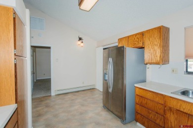 Beautiful Townhome with Mountain Views Bordering Black Canyon on Black Canyon Golf Club At Montrose in Colorado - for sale on GolfHomes.com, golf home, golf lot