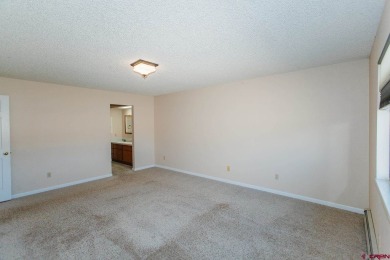 Beautiful Townhome with Mountain Views Bordering Black Canyon on Black Canyon Golf Club At Montrose in Colorado - for sale on GolfHomes.com, golf home, golf lot
