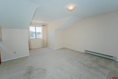 Beautiful Townhome with Mountain Views Bordering Black Canyon on Black Canyon Golf Club At Montrose in Colorado - for sale on GolfHomes.com, golf home, golf lot