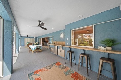 This 4BR/3BA CBS pool home sits on a private 1-acre cul-de-sac on Evergreen Club in Florida - for sale on GolfHomes.com, golf home, golf lot