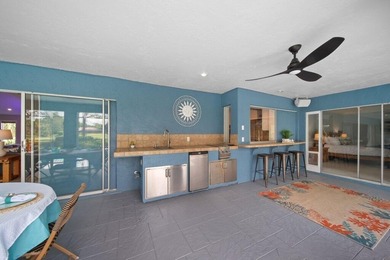 This 4BR/3BA CBS pool home sits on a private 1-acre cul-de-sac on Evergreen Club in Florida - for sale on GolfHomes.com, golf home, golf lot