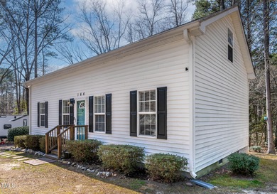 A MUST SEE! Charming 2-Bedroom, 2-Bathroom Cottage in the Gated on River Golf and Country Club at Lake Royale in North Carolina - for sale on GolfHomes.com, golf home, golf lot