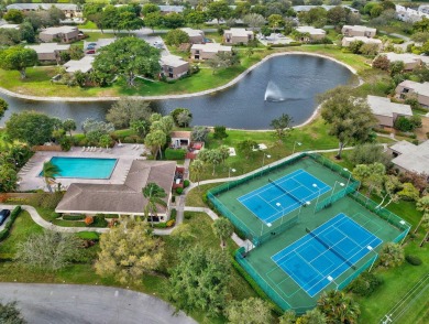 Experience the ultimate Delray Beach lifestyle in this remodeled on Delaire Golf and Country Club in Florida - for sale on GolfHomes.com, golf home, golf lot