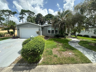This well loved 2 bedroom, 2 bathroom Palm Harbor home is being on Del Tura Golf and Country Club in Florida - for sale on GolfHomes.com, golf home, golf lot