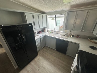 This well loved 2 bedroom, 2 bathroom Palm Harbor home is being on Del Tura Golf and Country Club in Florida - for sale on GolfHomes.com, golf home, golf lot